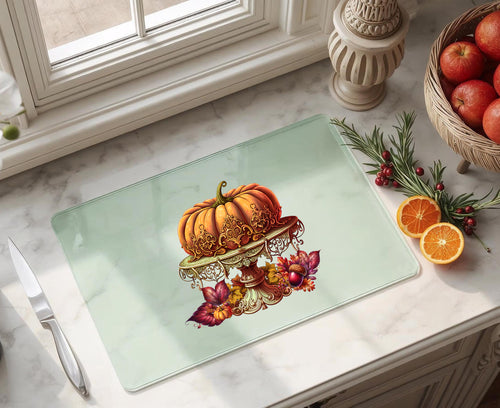 Pumpkin on ornate gold cake stand surrounded by autumn leaves, 11x15 inch tempered glass cutting board Halloween decor, thanksgiving decorations