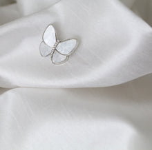 Load image into Gallery viewer, Silver trim butterfly brooch with pale gray mother of pearl shell, elegant jewelry pin for women’s scarves, dresses, shawls, and blazers.
