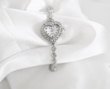 Load image into Gallery viewer, Heart-shaped rhinestone quartz watch with mother-of-pearl face, silver tone adjustable bracelet, vintage inspired design
